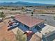 Expansive single-story home featuring a red tile roof, multiple garages, and a vast desert landscape at 3251 S Parkridge Ave, Pahrump, NV 89048