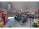 Spacious garage featuring a vintage car, work bench, and abundant storage space at 3251 S Parkridge Ave, Pahrump, NV 89048