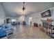 Open-concept living room with a fireplace and hardwood flooring at 3251 S Parkridge Ave, Pahrump, NV 89048