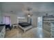 Main bedroom with tiled floor, walk-in closet, a ceiling fan, and an ensuite bathroom at 3251 S Parkridge Ave, Pahrump, NV 89048