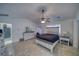 Main bedroom with tiled floor, a ceiling fan, and a door to the exterior of the home at 3251 S Parkridge Ave, Pahrump, NV 89048