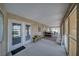 Enclosed patio with textured walls, neutral flooring and classic furniture at 3251 S Parkridge Ave, Pahrump, NV 89048