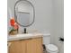 Modern half-bathroom with a stone countertop and updated sink at 328 Hedgehope Dr, Las Vegas, NV 89183