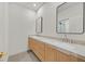 Modern bathroom featuring a dual sink vanity with contemporary fixtures and mirrors at 328 Hedgehope Dr, Las Vegas, NV 89183