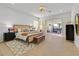 Bright bedroom featuring a sliding door to a patio and modern furnishings at 328 Hedgehope Dr, Las Vegas, NV 89183