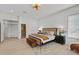 Well-lit bedroom with a bed, nightstands, and a walk-in closet at 328 Hedgehope Dr, Las Vegas, NV 89183