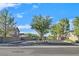 Image of the community entrance. San Rafael neighborhood features mature trees and gated access at 328 Hedgehope Dr, Las Vegas, NV 89183