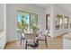 Dining area with a table and chairs, with views of the backyard at 328 Hedgehope Dr, Las Vegas, NV 89183