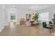 Bright dining area with a modern chandelier, sleek furniture, and light hardwood flooring at 328 Hedgehope Dr, Las Vegas, NV 89183