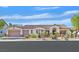 Charming single-story home featuring a tile roof, desert landscaping, and an attached two-car garage at 328 Hedgehope Dr, Las Vegas, NV 89183