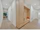Hallway with hardwood floors and a built-in storage unit with bench seating at 328 Hedgehope Dr, Las Vegas, NV 89183