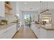 Well-appointed kitchen features sleek cabinetry, stainless steel appliances, and convenient access to the backyard at 328 Hedgehope Dr, Las Vegas, NV 89183