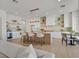 Open kitchen with an island, bar stool seating and modern lighting at 328 Hedgehope Dr, Las Vegas, NV 89183