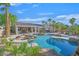 Backyard oasis featuring a pool with rock features and landscaping, ideal for relaxation at 328 Hedgehope Dr, Las Vegas, NV 89183