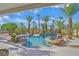 Backyard pool with rock features, a waterfall, and a swim-up bar at 328 Hedgehope Dr, Las Vegas, NV 89183