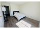 Cozy bedroom featuring modern floors, a comfortable bed, and contemporary decor at 3508 Harbor Tides St, Las Vegas, NV 89147