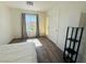 Sunny bedroom with a large window, featuring stylish floors and a patio door at 3508 Harbor Tides St, Las Vegas, NV 89147