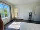 Bright bedroom with a large window and modern flooring, filled with natural light at 3508 Harbor Tides St, Las Vegas, NV 89147