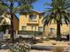 Landscaped exterior view of home featuring a mature palm tree and green shrubs at 3508 Harbor Tides St, Las Vegas, NV 89147