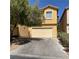 Two-story house featuring a two-car garage, driveway, and partial tree coverage at 3508 Harbor Tides St, Las Vegas, NV 89147