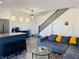 Open-concept living room featuring modern decor, wood floors, and a kitchen with a center island at 3508 Harbor Tides St, Las Vegas, NV 89147
