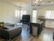Contemporary living room showcasing an island kitchen and couch at 3508 Harbor Tides St, Las Vegas, NV 89147