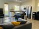 Cozy living room with an island kitchen and stainless steel appliances at 3508 Harbor Tides St, Las Vegas, NV 89147