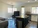 Living room featuring an island kitchen and hardwood floors at 3508 Harbor Tides St, Las Vegas, NV 89147