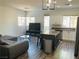 Open living space features an island kitchen and hardwood floors at 3508 Harbor Tides St, Las Vegas, NV 89147