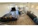 Spacious living room and kitchen with modern decor, wood floors, and ample natural light at 3508 Harbor Tides St, Las Vegas, NV 89147