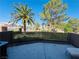 Serene patio with views of lush palms and meticulously maintained landscaping at 3508 Harbor Tides St, Las Vegas, NV 89147