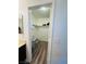 Walk-in closet featuring shelving and a rod for hanging clothes, with hardwood floors at 3508 Harbor Tides St, Las Vegas, NV 89147