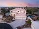 Beautiful aerial view of a two-story house with a pool and meticulously landscaped yard in a gated community at 352 Angels Trace Ct, Las Vegas, NV 89148