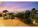 Relaxing backyard patio featuring elegant landscaping, a fire pit, and comfortable lounge seating at 352 Angels Trace Ct, Las Vegas, NV 89148