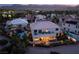 This backyard features a pool with rock features, slide, outdoor seating, and the mountains in the distance at 352 Angels Trace Ct, Las Vegas, NV 89148