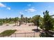 Backyard view overlooking a lush golf course with mature landscaping at 352 Angels Trace Ct, Las Vegas, NV 89148