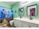 Bathroom showcasing dual sinks, colorful fish shower curtain, and modern fixtures at 352 Angels Trace Ct, Las Vegas, NV 89148