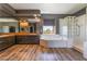 Bathroom with tub, walk-in shower, dual sinks, and dark walls with nice trim at 352 Angels Trace Ct, Las Vegas, NV 89148