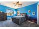 bedroom featuring two large windows and light blue walls at 352 Angels Trace Ct, Las Vegas, NV 89148
