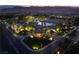 The community features a clubhouse, swimming pool, palm trees, green grass, and well maintained landscapes at 352 Angels Trace Ct, Las Vegas, NV 89148