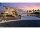Charming two-story home featuring a well-manicured lawn, three-car garage, and inviting front entrance at 352 Angels Trace Ct, Las Vegas, NV 89148