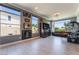 Relaxing game room with modern decor, stylish bar, and a comfortable seating area for socializing and entertainment at 352 Angels Trace Ct, Las Vegas, NV 89148