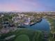 Community featuring a lake, golf course, and lush landscaping near businesses in a desert community at 352 Angels Trace Ct, Las Vegas, NV 89148