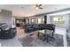 Open-concept living room with an entertainment system, a fireplace, and a large, comfortable sectional sofa at 352 Angels Trace Ct, Las Vegas, NV 89148