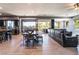 Open-concept living space featuring a dining area, living room, and kitchen with lots of natural light and outdoor views at 352 Angels Trace Ct, Las Vegas, NV 89148