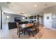 Open-concept living space featuring dining area, large fireplace and entertainment center at 352 Angels Trace Ct, Las Vegas, NV 89148