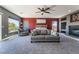 Comfortable main bedroom with large seating area, fireplace, and soft, neutral carpeting at 352 Angels Trace Ct, Las Vegas, NV 89148