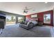 Spacious main bedroom featuring a lounge area, access to a private balcony, and modern decor at 352 Angels Trace Ct, Las Vegas, NV 89148