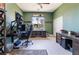 Home office featuring two large monitors and a bright window view at 352 Angels Trace Ct, Las Vegas, NV 89148