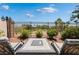 Outdoor lounge featuring comfortable seating, a view of the golf course and manicured landscaping at 352 Angels Trace Ct, Las Vegas, NV 89148